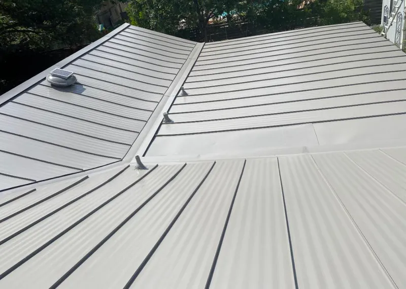 Solar attic fan installed on a metal roof for Roof Ventilation in Floyds Knobs